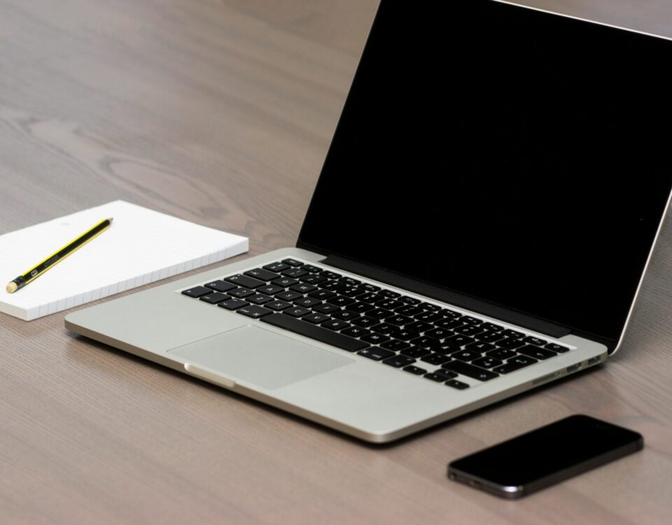 Free Silver Macbook Beside Iphone Stock Photo