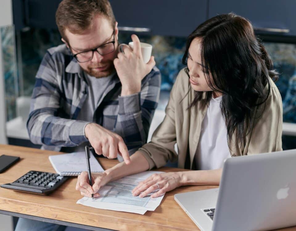 Free couple calculating al their bills stock photo