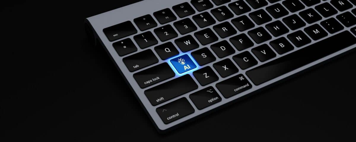 a black keyboard with a blue button on it