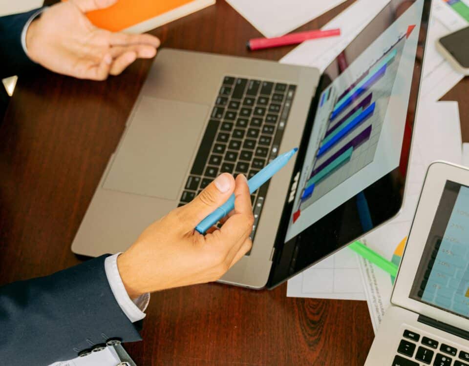 Free A Person in Black Suit Holding a Pen Stock Photo